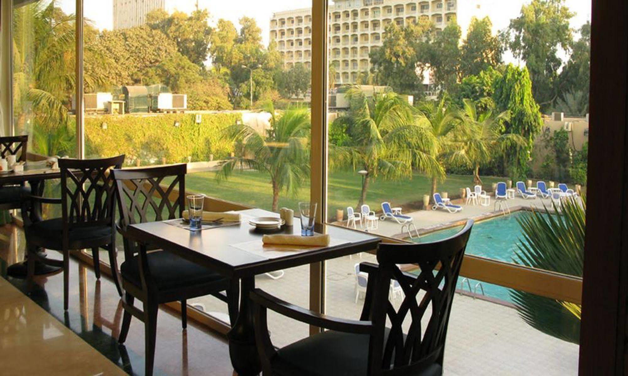 Avari Towers Karachi Exterior photo The pool at the Grand Hotel