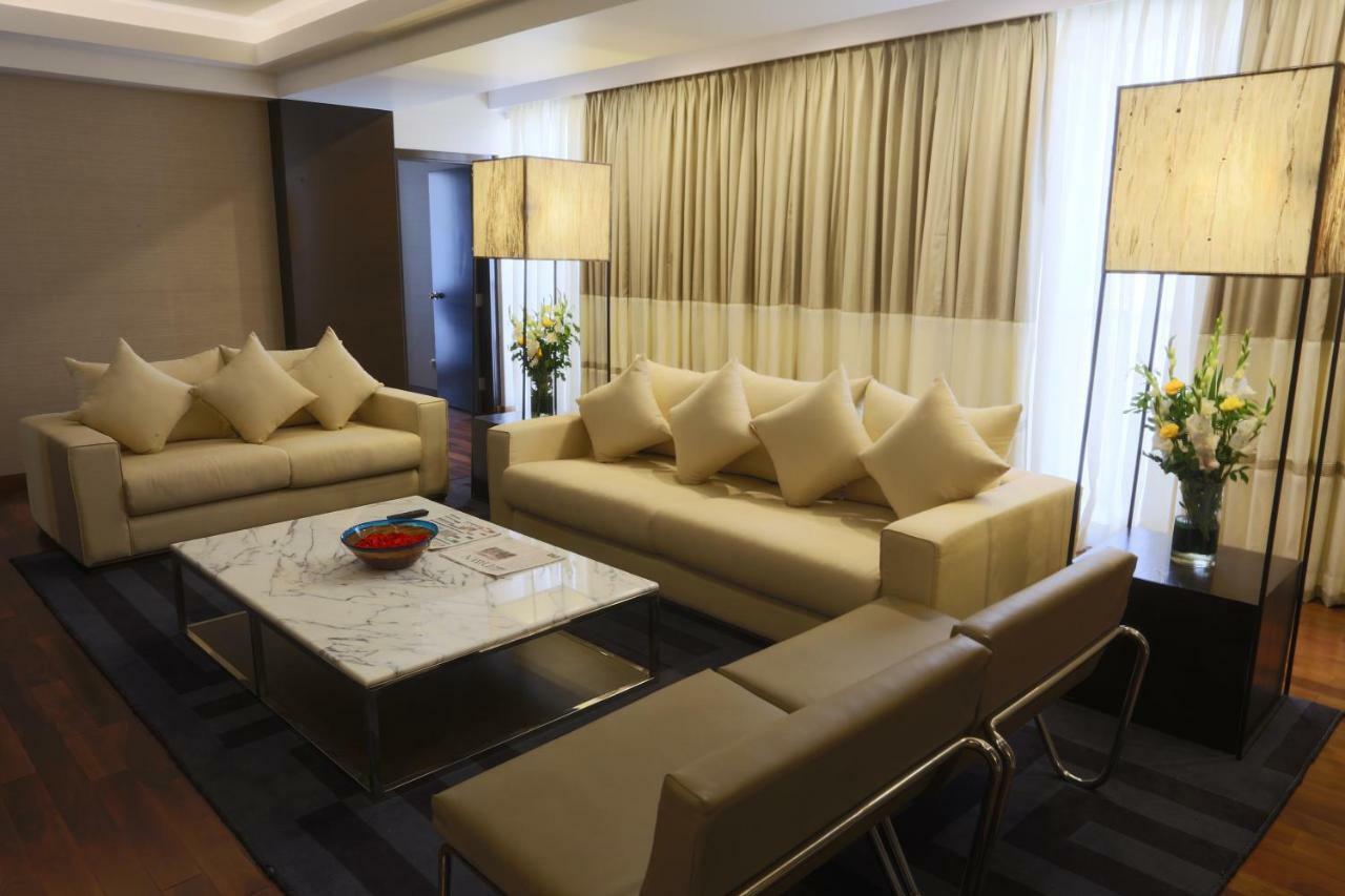 Avari Towers Karachi Exterior photo A living room in a suite at the Mandarin Oriental, Kuala Lumpur